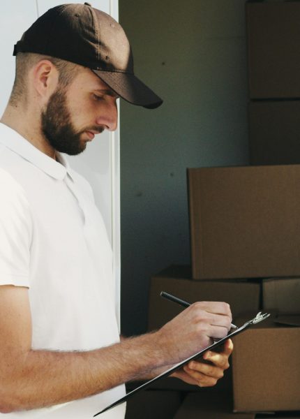 Delivery Driver Holding Clipboard